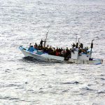 Refugees_on_a_boat-sized