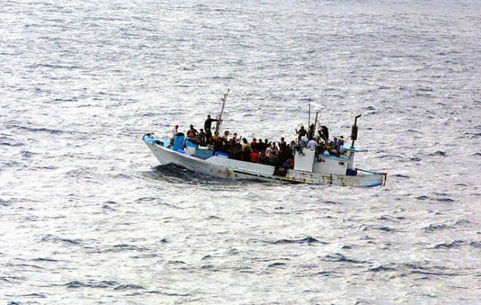 Refugees_on_a_boat-sized